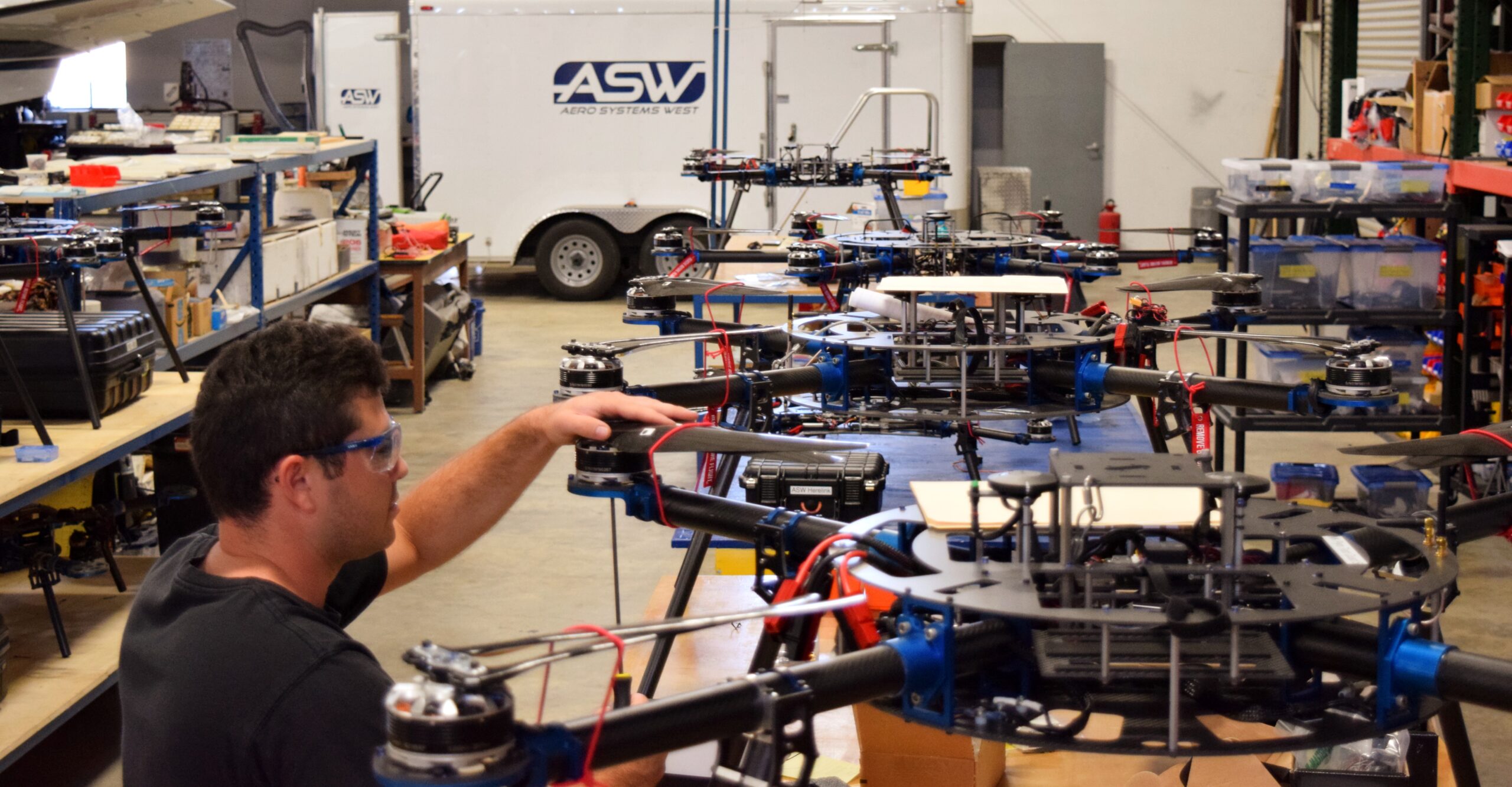 Technician assembling a custom UAV for specialized applications.