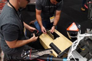 Aero Systems West Employees Inspect Elistair Tethered Drone Equipment