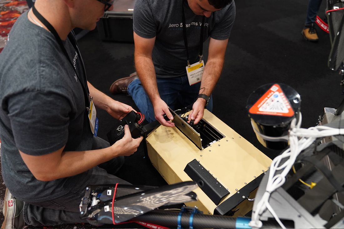 Aero Systems West Employees Inspect Elistair Tethered Drone Equipment